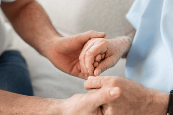 holding hands to give support