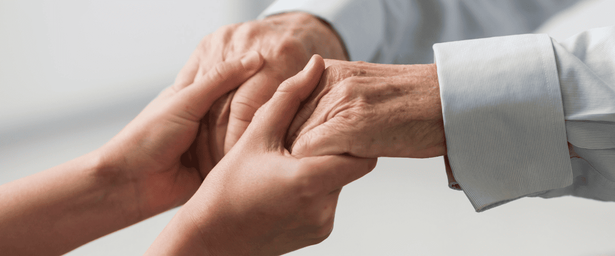 holding-hand-caring-for-Your-Loved-One-with-Parkinson-Disease